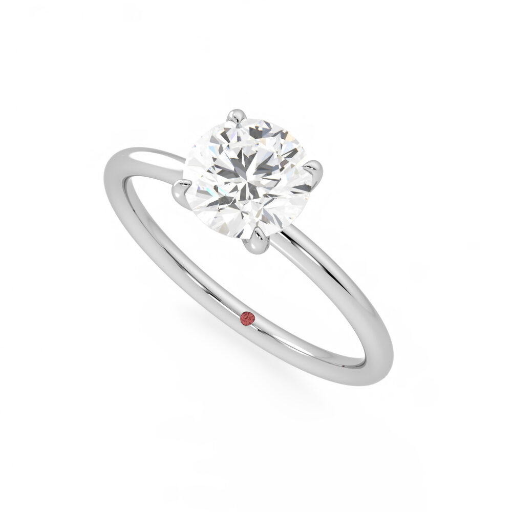 demure platinum round diamond four claw solitaire
